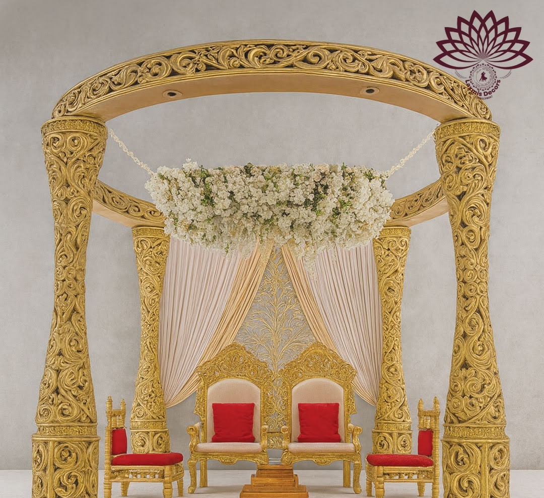 Couple celebrating beneath a decorated wedding mandap